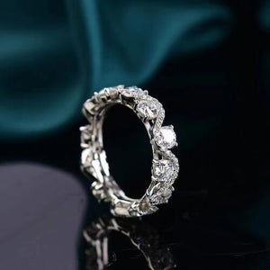 a diamond ring sitting on top of a table