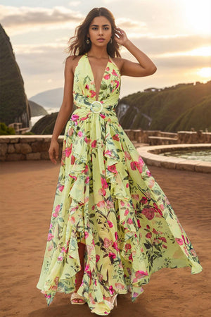 a woman standing on a beach wearing a dress