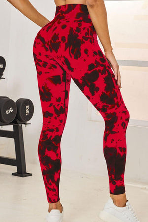 a woman in a red and black print leggings