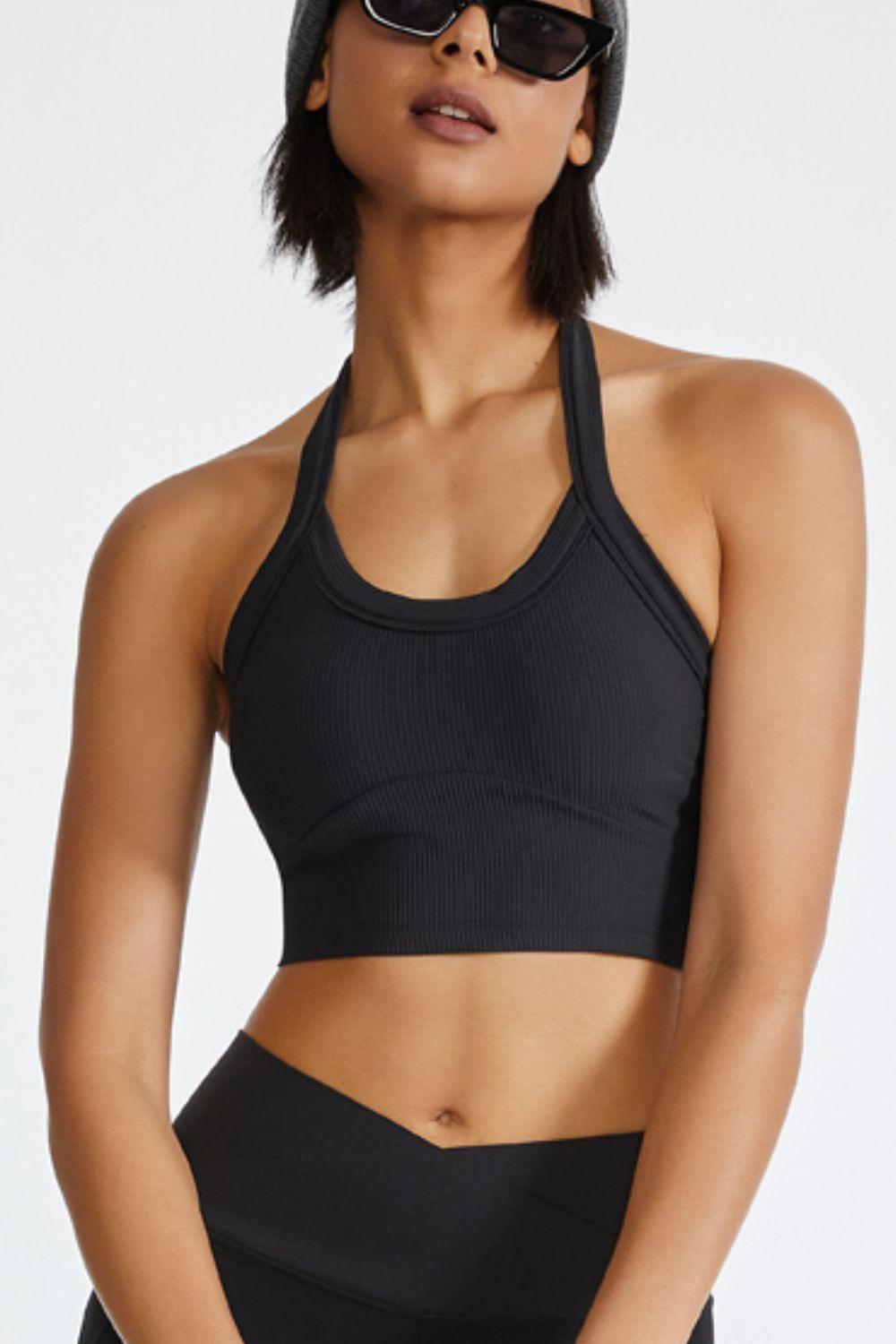 a woman wearing a black sports bra top