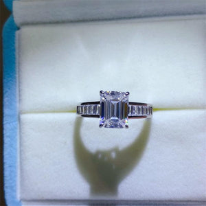 a ring with a diamond in it sitting in a box