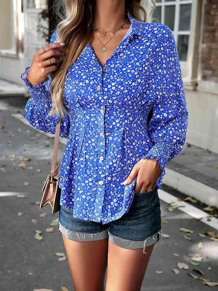 a woman wearing a blue shirt and denim shorts