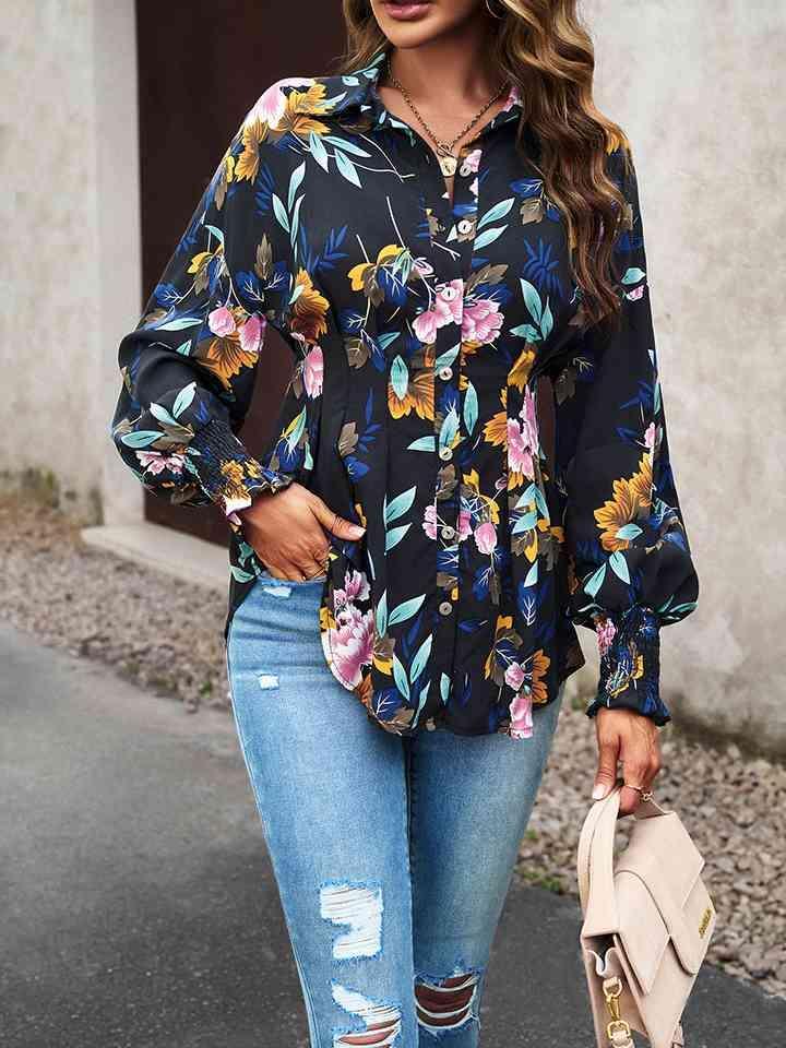 a woman wearing ripped jeans and a floral shirt