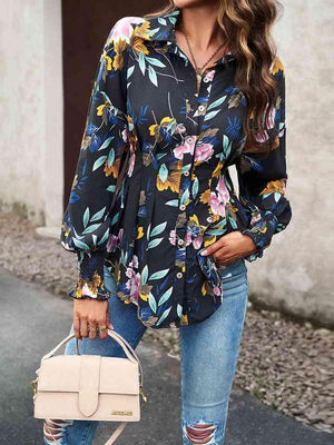 a woman wearing a floral shirt and ripped jeans