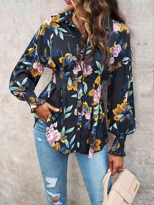 a woman wearing a floral shirt and ripped jeans