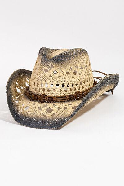 a cowboy hat with a lace pattern on it