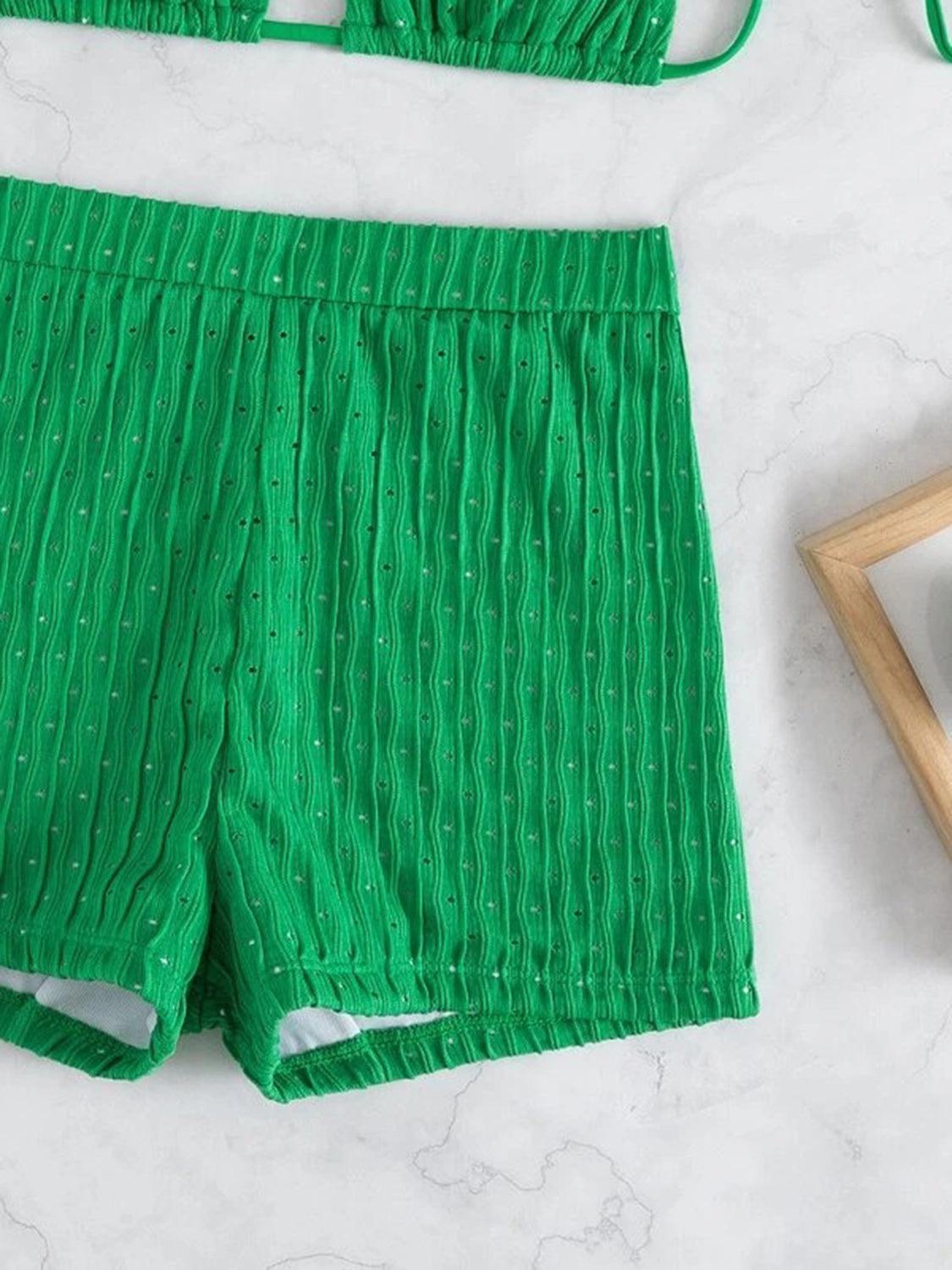 a pair of green shorts next to a picture frame
