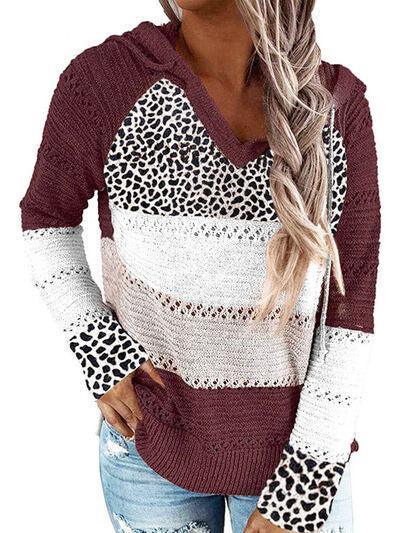 a woman wearing a leopard print sweater