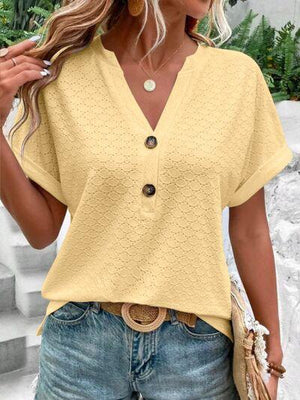 a woman wearing a yellow top and jeans