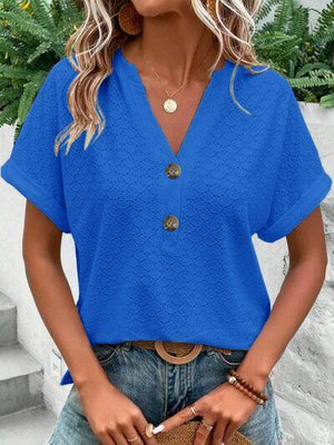 a woman wearing a blue top and jeans