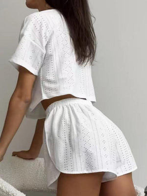 a woman in a white shirt and shorts