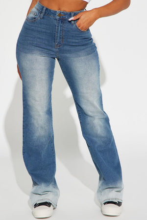 a woman wearing a pair of blue jeans