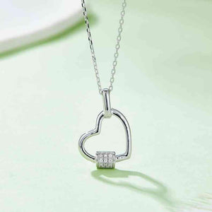 a heart shaped pendant on a chain