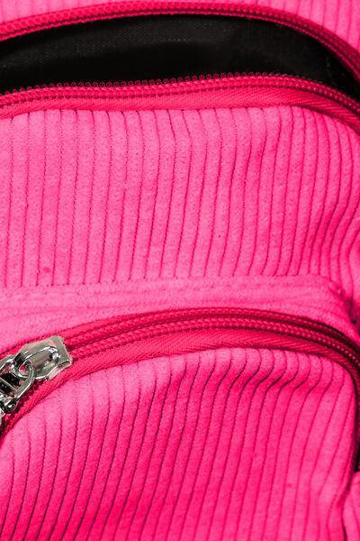 a close up of a pink bag with a zipper