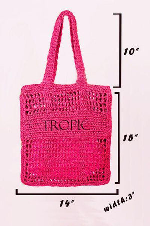 a pink crocheted bag with the word tropic printed on it