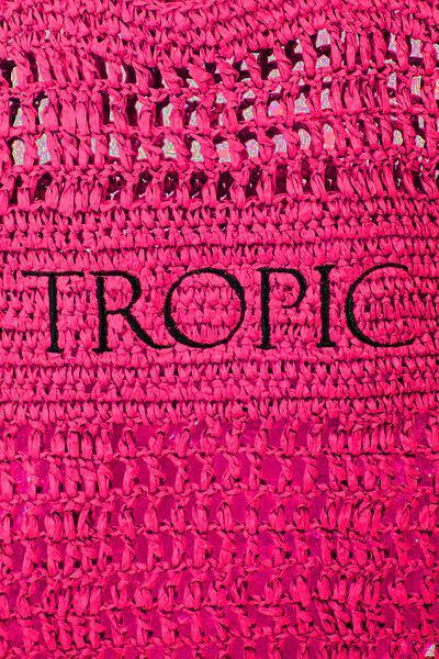 a close up of a pink shirt with the word tropic on it