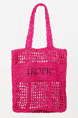 a pink tote bag hanging from a hook