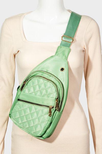 a green purse on a mannequin torso