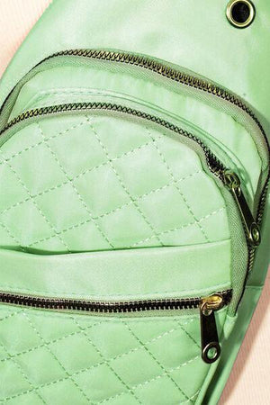 a green backpack with a zipper on it