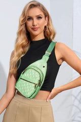 a woman wearing a green fanny bag