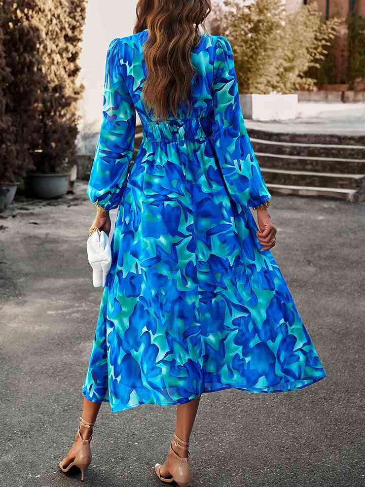 a woman in a blue dress is walking down the street