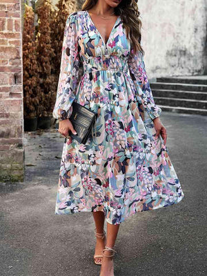 a woman wearing a floral print dress
