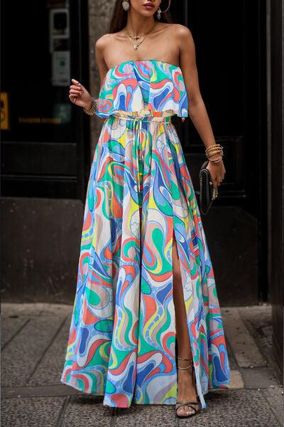 a woman in a colorful dress is walking down the street