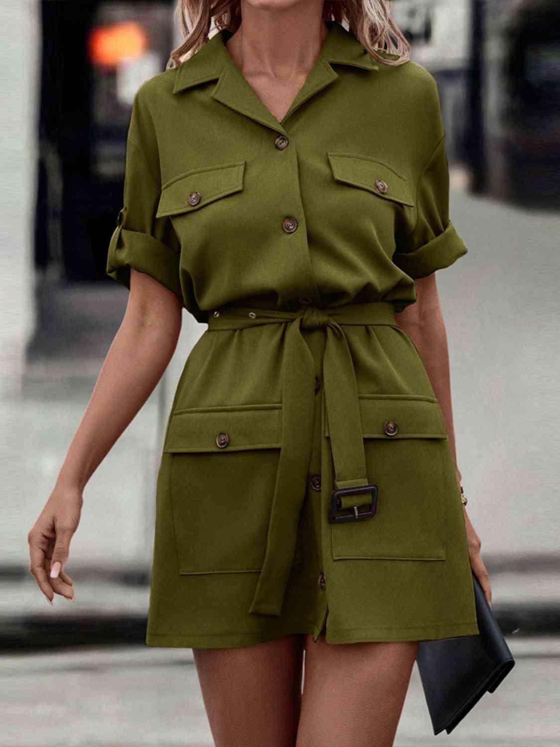 a woman walking down a street wearing a green shirt dress