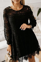 a woman wearing a black lace dress