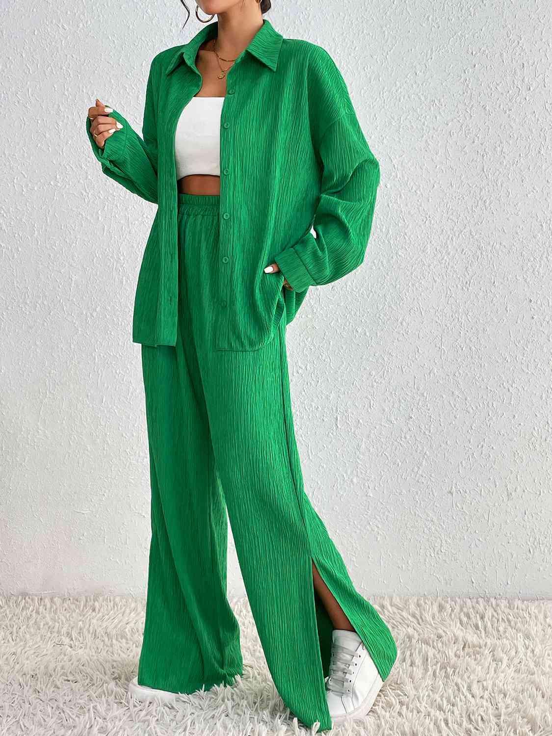 a woman wearing a green suit and white top