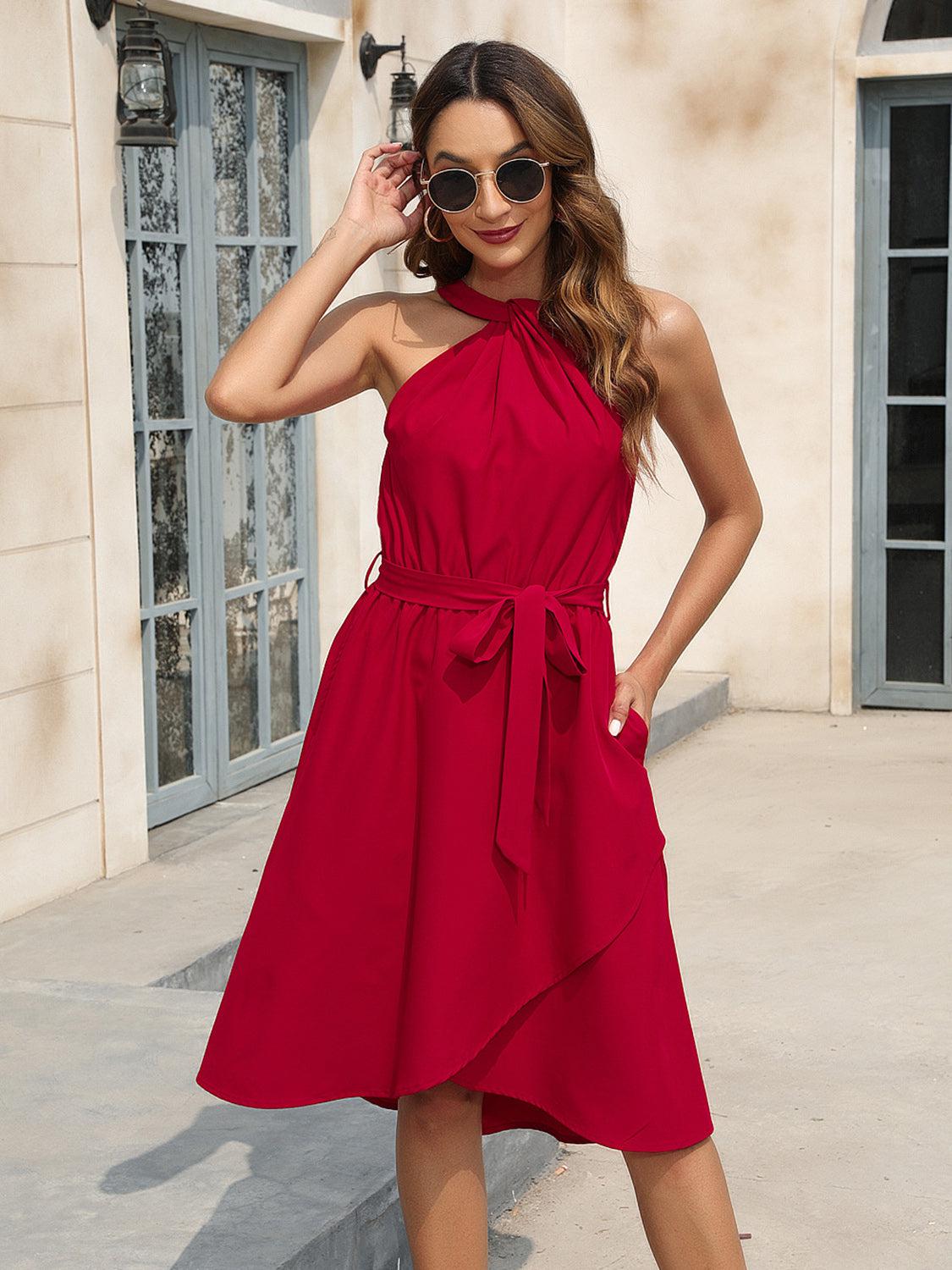 a woman in a red dress posing for a picture