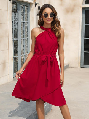 a woman wearing a red dress and sunglasses