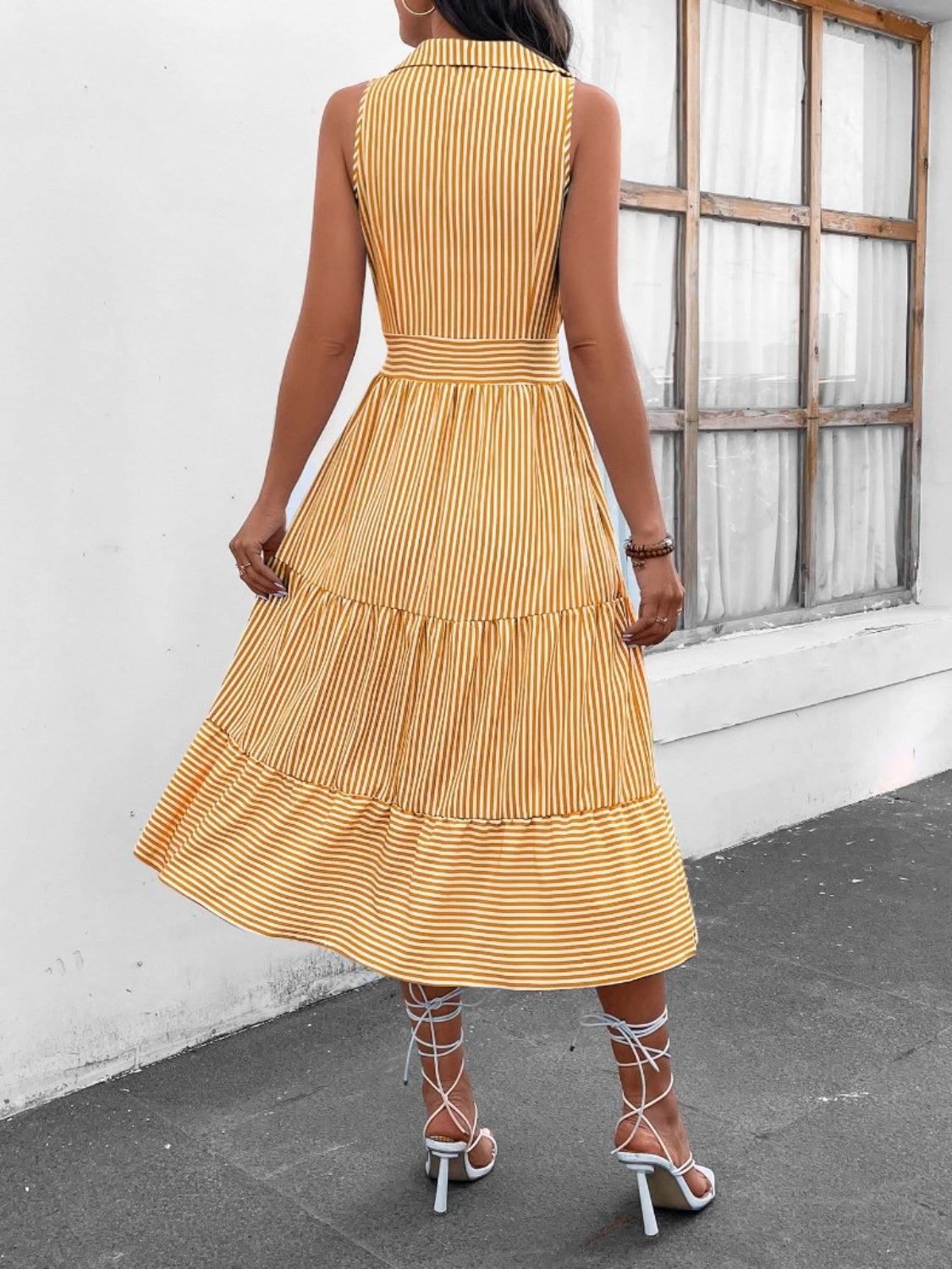 a woman in a yellow striped dress