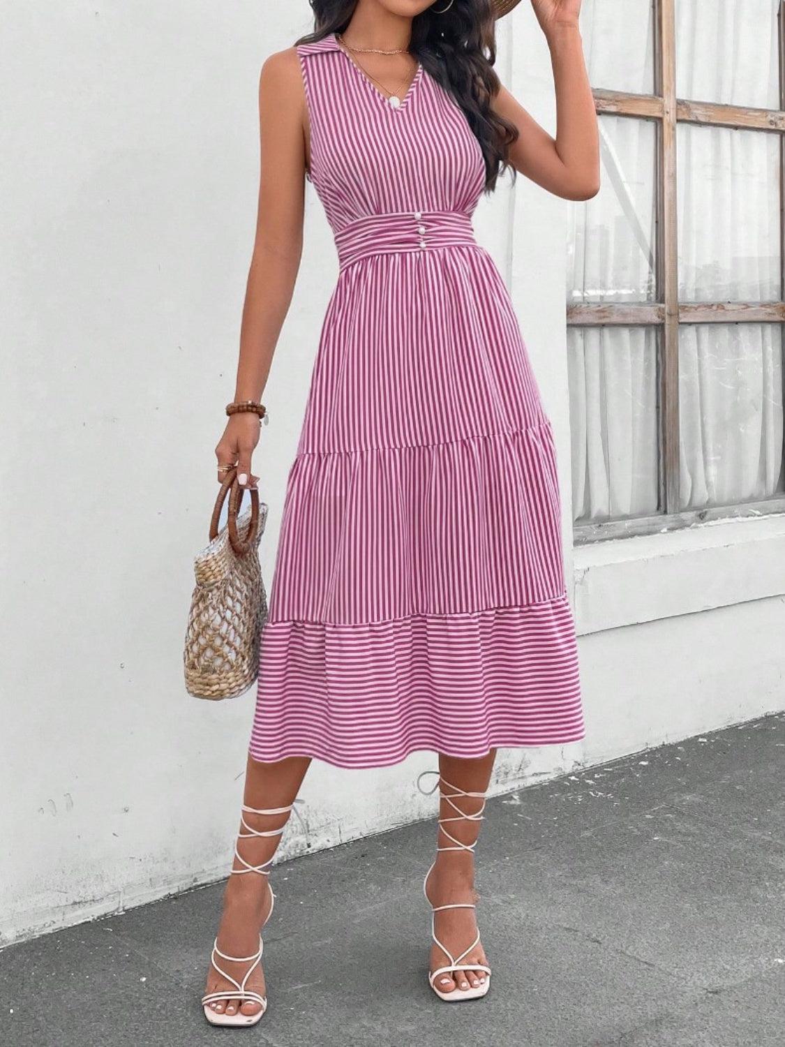 a woman wearing a pink and white striped dress