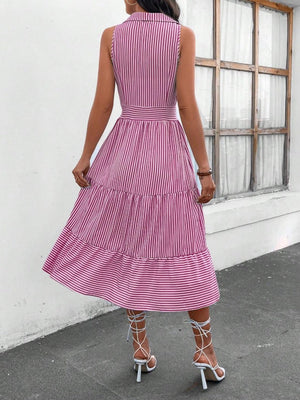 a woman wearing a pink and white striped dress