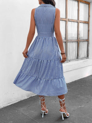 a woman wearing a blue and white striped dress