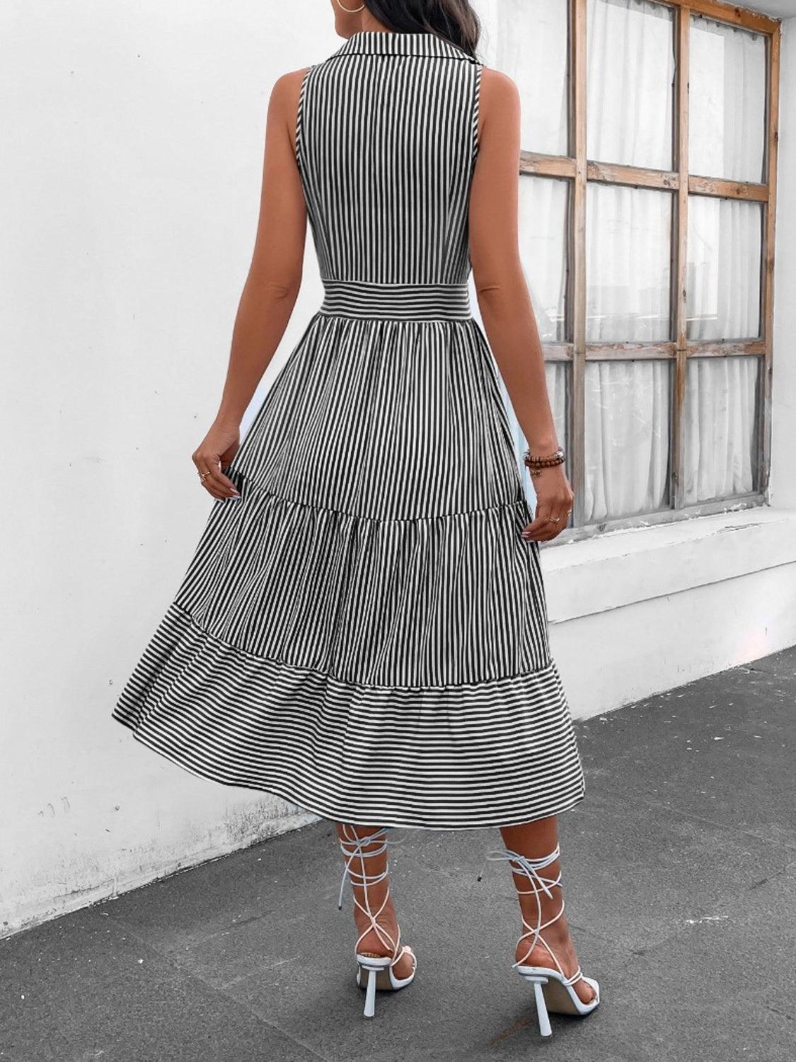 a woman in a black and white striped dress