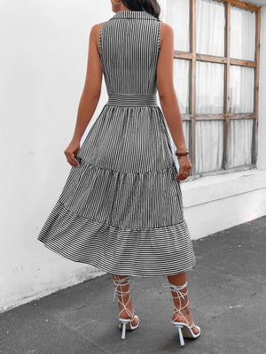 a woman in a black and white striped dress