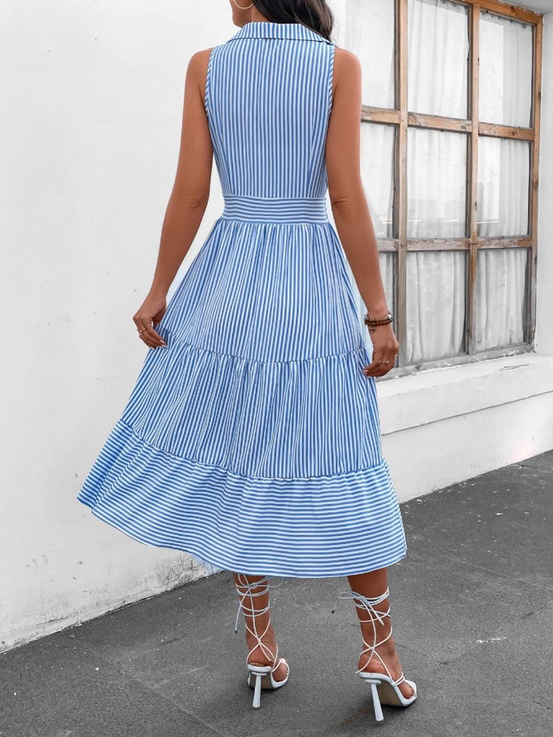 a woman wearing a blue and white striped dress