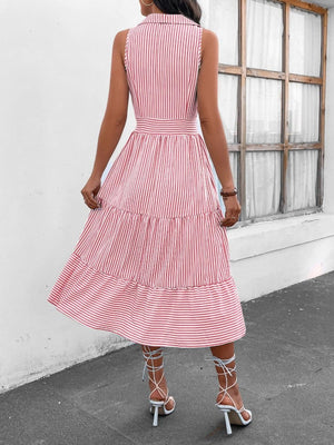 a woman wearing a red and white striped dress