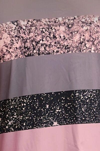 a close up of a pink and black shower curtain