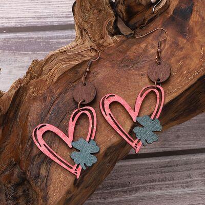 a pair of pink and blue heart shaped earrings