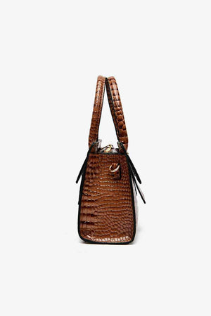 a brown handbag on a white background