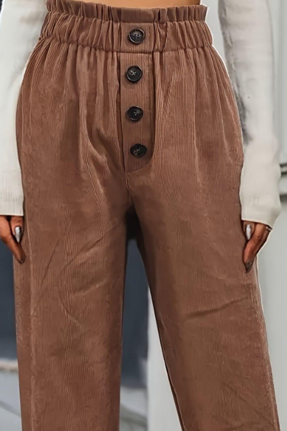 a close up of a person wearing brown pants