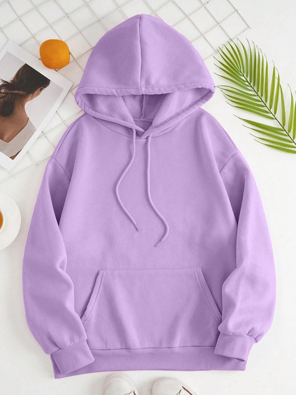 a purple hoodie sitting on top of a white table