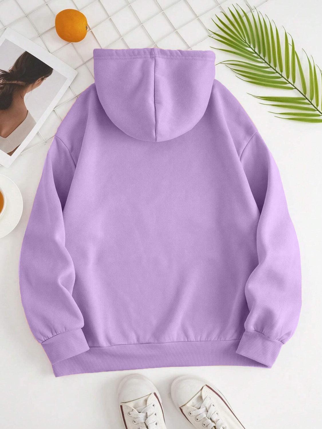 a purple hoodie with a pair of white shoes next to it