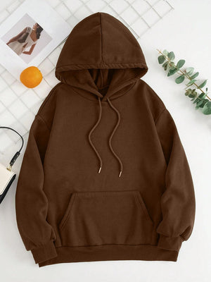 a brown hoodie sitting on top of a white table