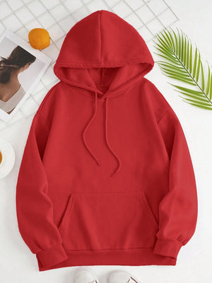 a red hoodie sitting on top of a white table
