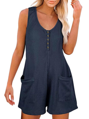 a woman wearing a blue romper and a hat