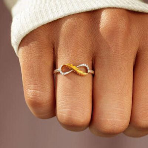 a woman's hand with a ring on it